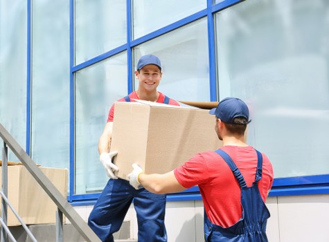 Worker wearing PPE while handling storage items