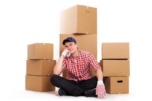 Professional movers handling furniture during a Goldersgreen house removal